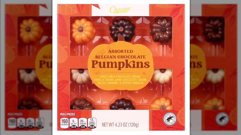A box of chocolates with a clear packaging, showing pumpkin-shaped bites.