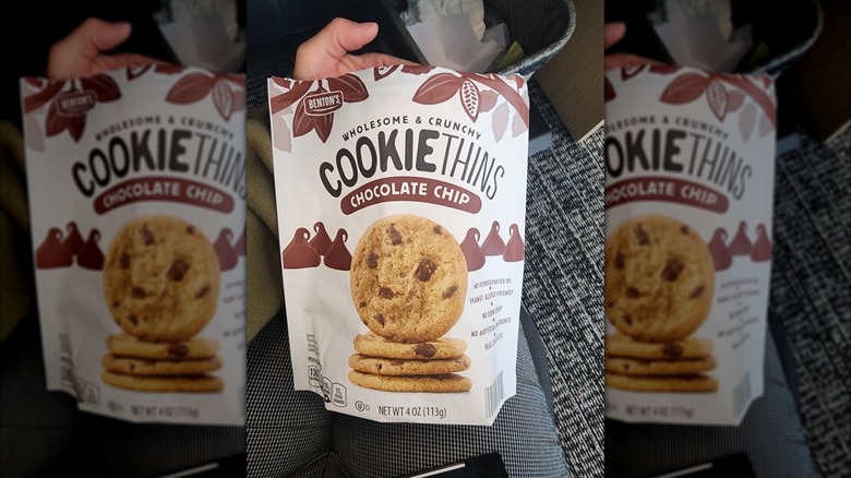Hand holding Benton's Chocolate Chip Cookie Thins