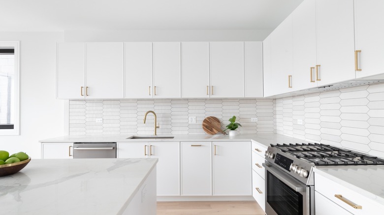 Beautifully clean kitchen with white subway tile.