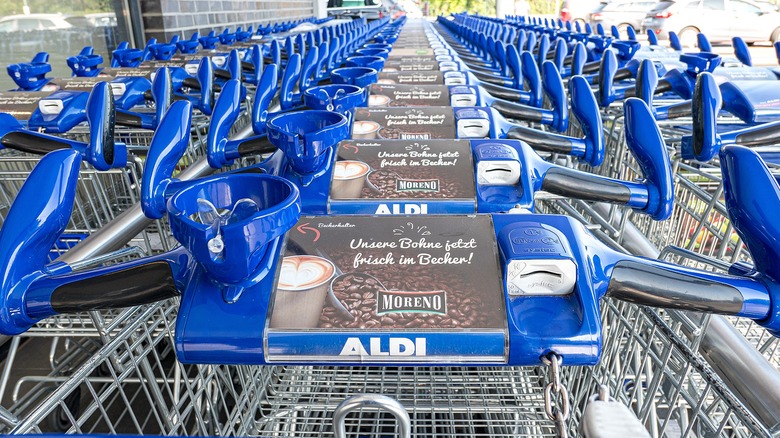Rows of Aldi shopping carts outside store