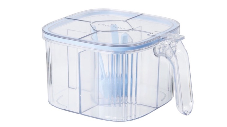 The Crofton Spice Jar with clear packaging, so you can see the four compartments for spices and one for the spoons.