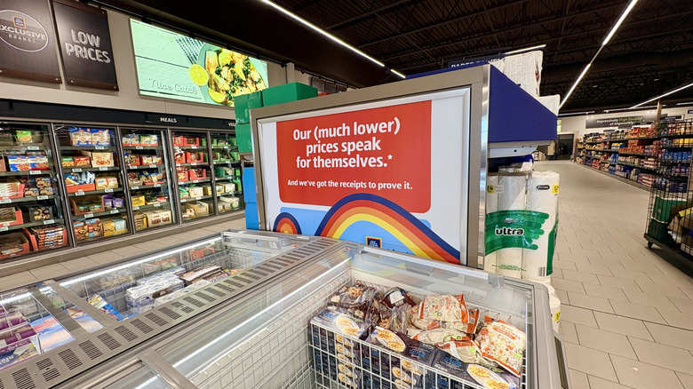Aldi freezer section featuring an aisle endcap advertisement