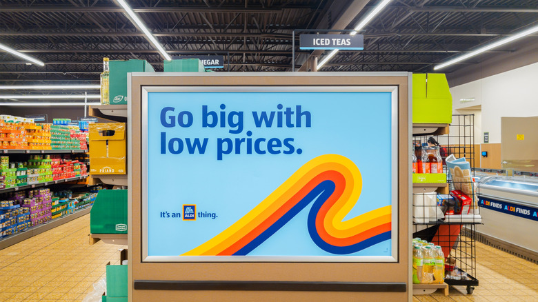 Aldi sign in a store that reads, "Go big with low prices."