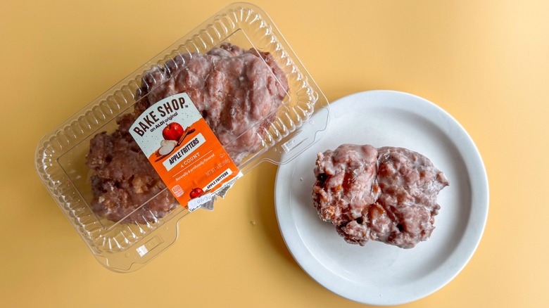 Apple fritters on a plate on a yellow background