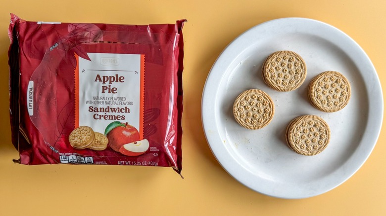 Apple pie sandwich cookies with plate of cookies