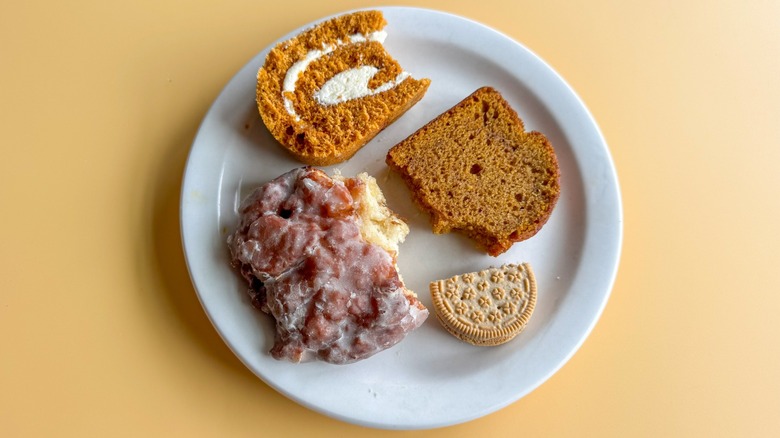 Plate with assorted fall treats on it on yellow background