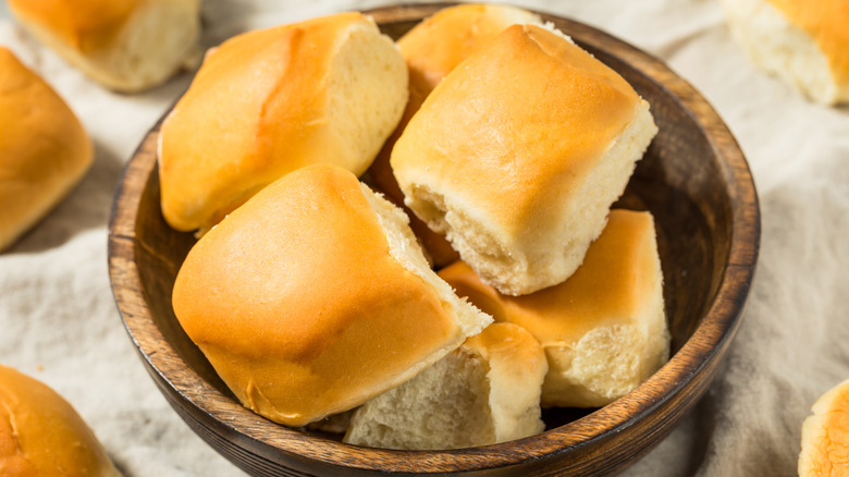 Wooden bowl of dinner rolls