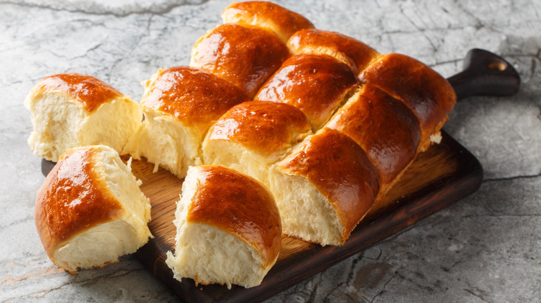 Hawaiian sweet rolls on a cutting board