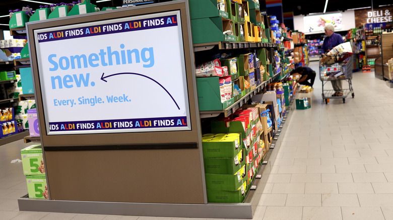 A sign for the Aldi Finds aisle inside an Aldi store.