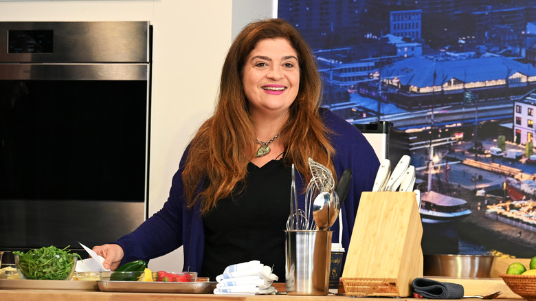 Alex Guarnaschelli giving a cooking demonstration.