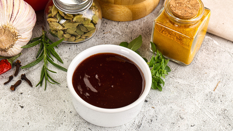 A bowl of tonkatsu sauce on a table