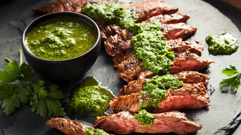 Sliced steak with chimichurri sauce