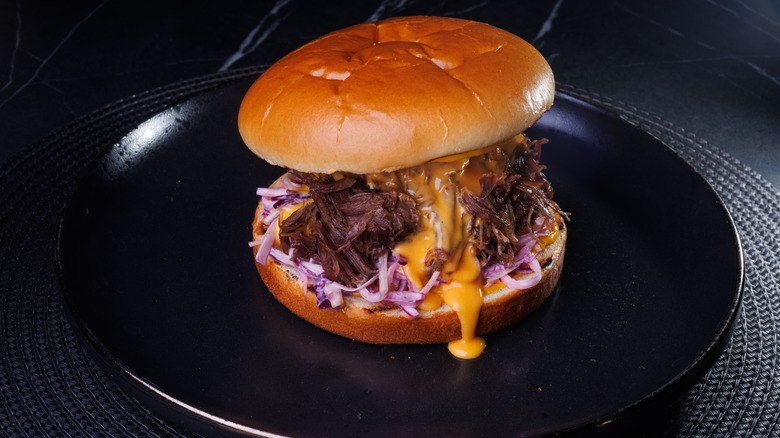 A pulled pork sandwich with Carolina gold barbecue sauce