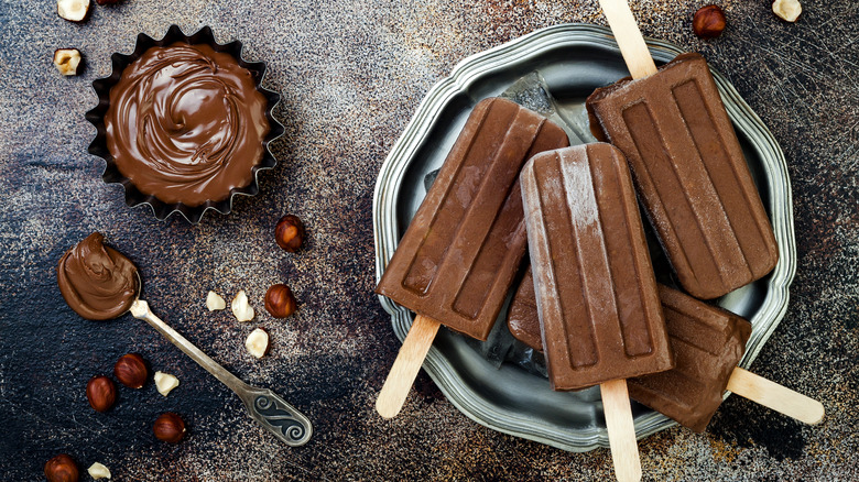 fudgy popsicles on a black plate