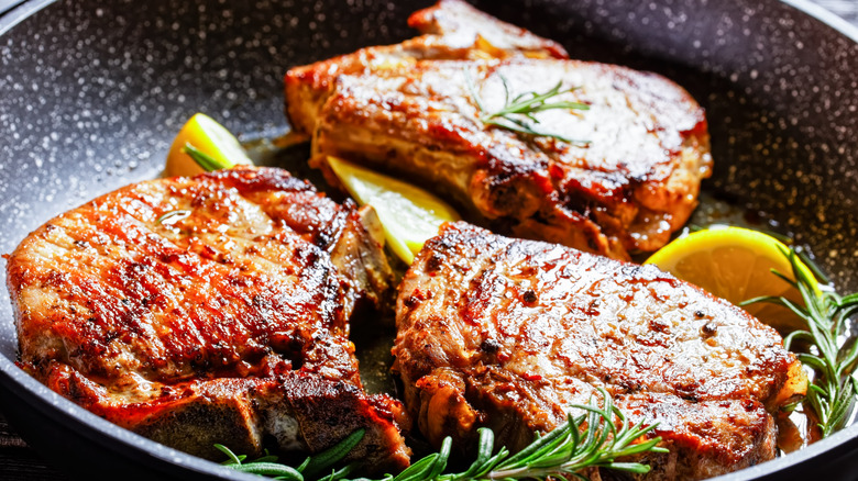 Crisp, golden pork chops in a pan