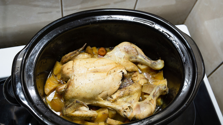 Whole chicken in a slow cooker.