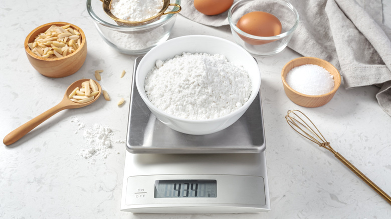 Bowl of flour on digital scale reading 434 grams