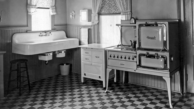 A kitchen in 1930 with a Monarch electric stove and oven appliance.
