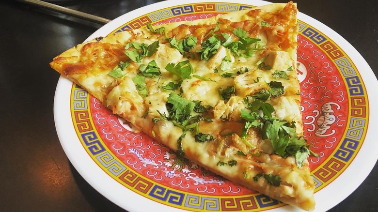 A slice of pizza from Fong's Pizza in Des Moines, Iowa