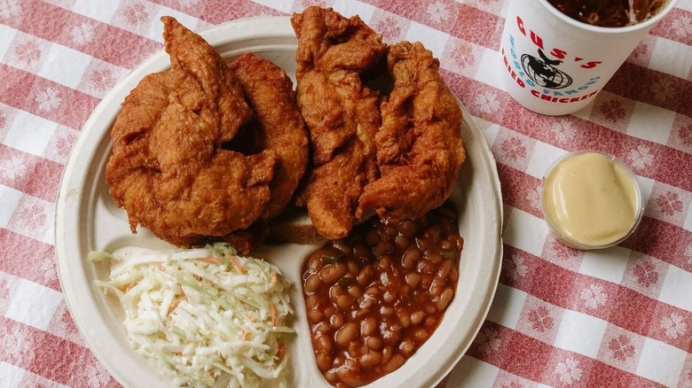 A plate of fried chicken, beans, and coleslaw at Gus's Fried Chicken in Memphis, Tennessee
