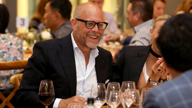 Alton Brown dining at a restaurant
