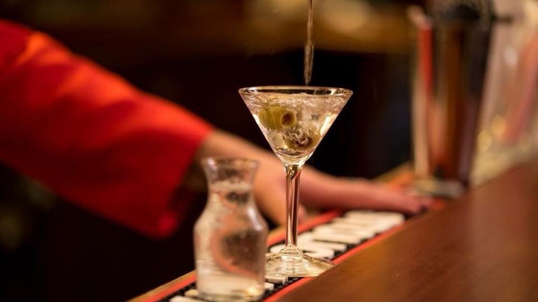 A bartender pouring a martini at Musso & Frank in Los Angeles
