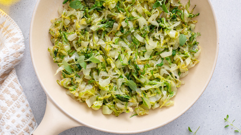 Sauteed green cabbage or lettuce with herbs, healthy side dish idea