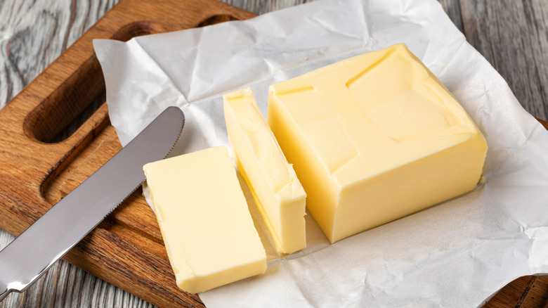 Sliced butter on a wooden board