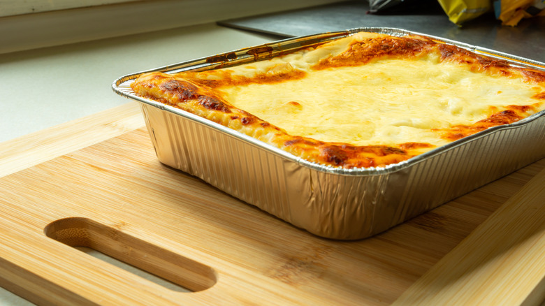 Homemade lasagna in an aluminum tray