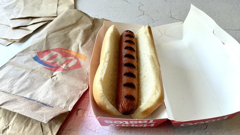 Dairy Queen hotdog opened and laying on branded packaging