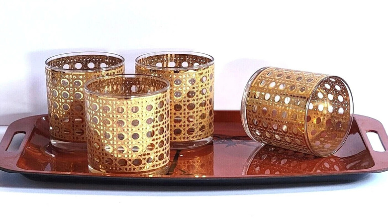 Tray of four Canella rocks glasses photographed against a white background