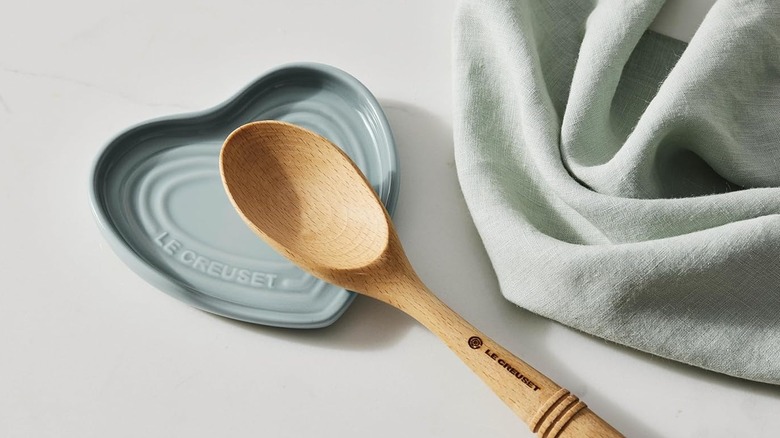 Spoon resting on heart shaped dish