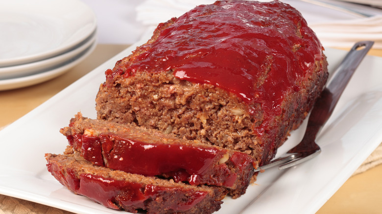 Meatloaf with glaze on a white plate