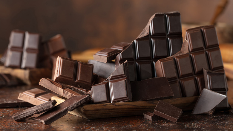 Fragments of chocolate bars on a table.