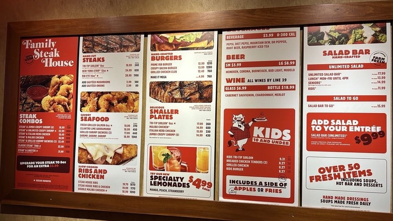 Sizzler's rebranded 2025 menu posted on a wall inside the restaurant
