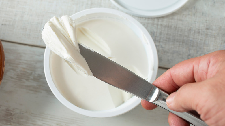 Cream cheese spread on a butter knife