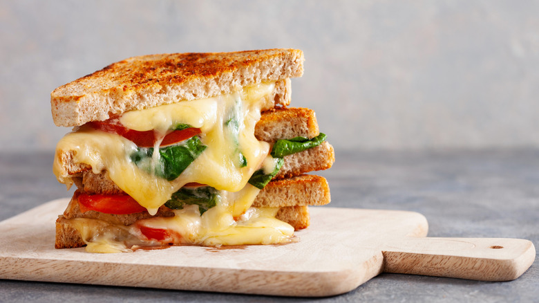 Grilled cheese sandwich with tomatoes and spinach