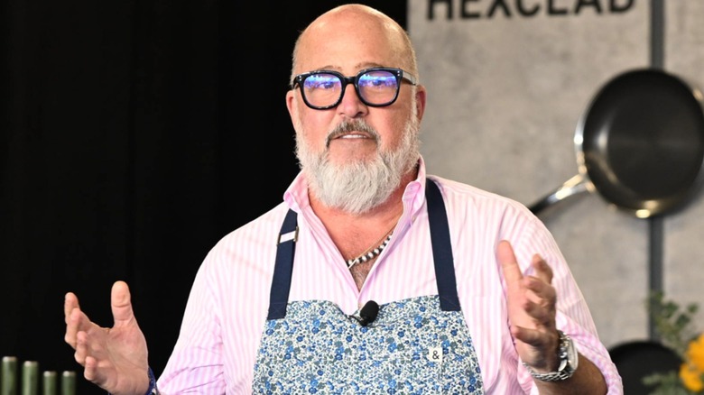 Andrew Zimmern talking in kitchen