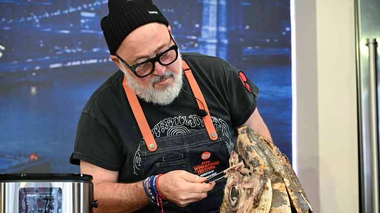 Chef Andrew Zimmern working with bizarre ingredients