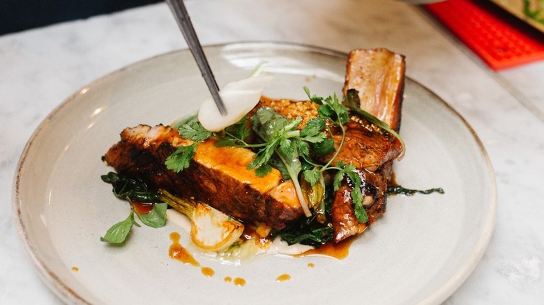 A tamarind glazed pork chop at Spoon & Stable in Minneapolis