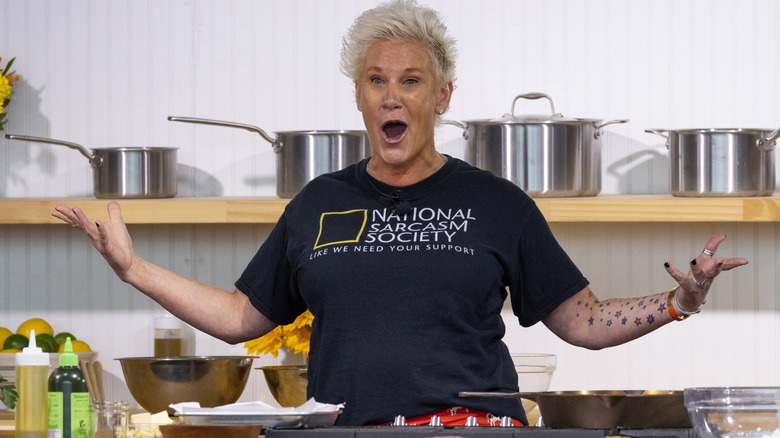 Anne Burrell standing in a kitchen