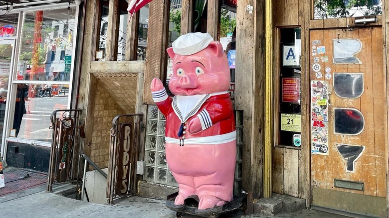 A pig statue in front Rudy's Bar and Grill in New York City