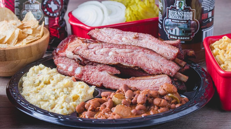 A plate of ribs, baked beans, and mashed potatoes from Burns Original BBQ in Houston