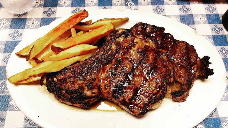 A steak and fries from Doe's Eat Place