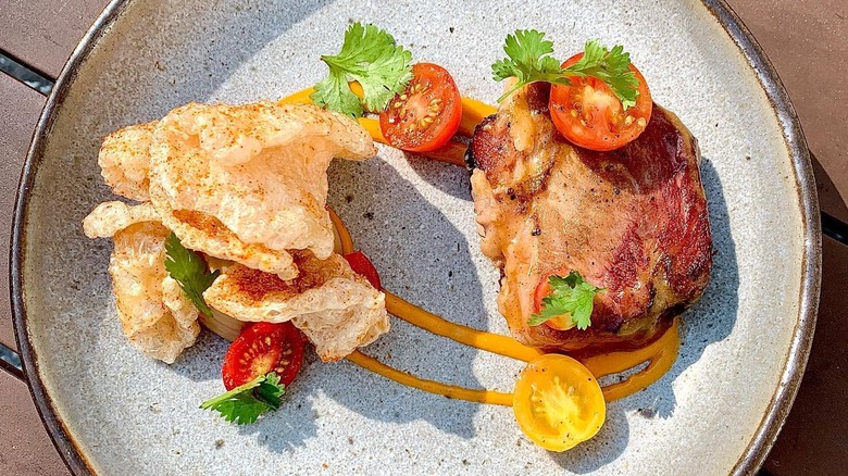 Smoked pork shoulder with spiced pork skins from Husk in Charleston