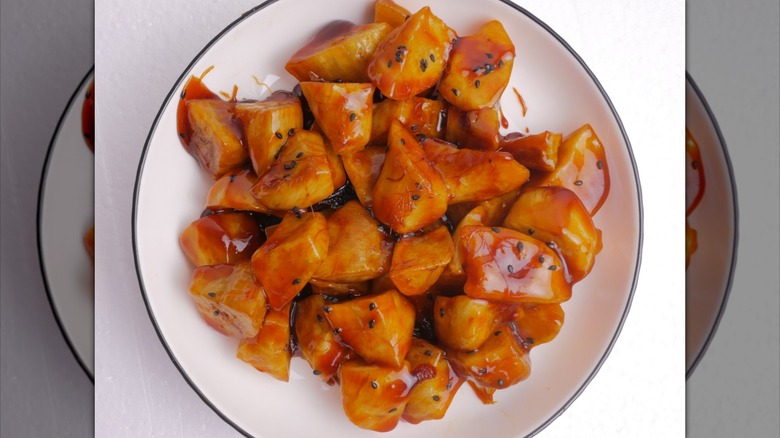 Candied sweet potatoes on a white plate