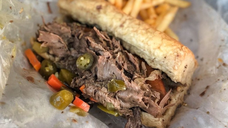 An Italian beef sandwich with a side of fries from Johnnie's Beef in Chicago
