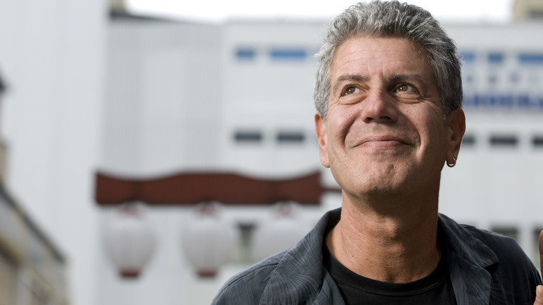 A smiling Anthony Bourdain looking up