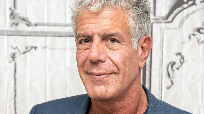 Anthony Bourdain looking into camera and smiling