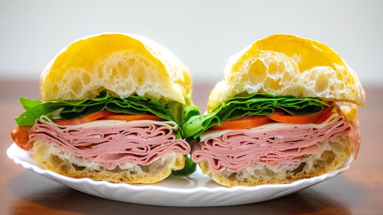 Mortadella sandwich on white plate